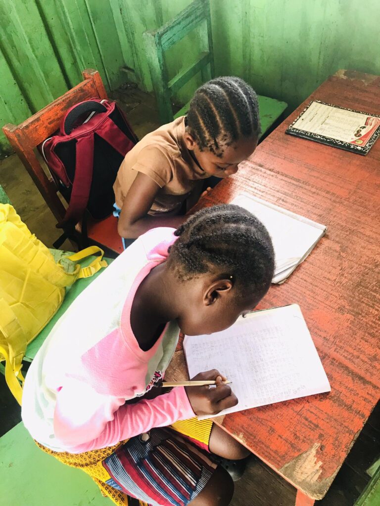 Liberia school kids doing homework